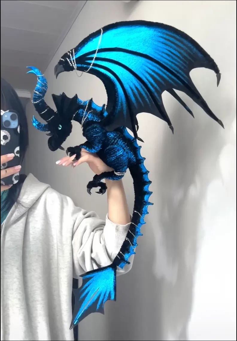 Handmade blue pipe cleaner dragon with poseable wings